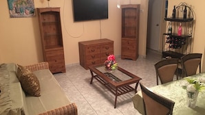 Room, 2 Bedrooms | Living room | Flat-screen TV