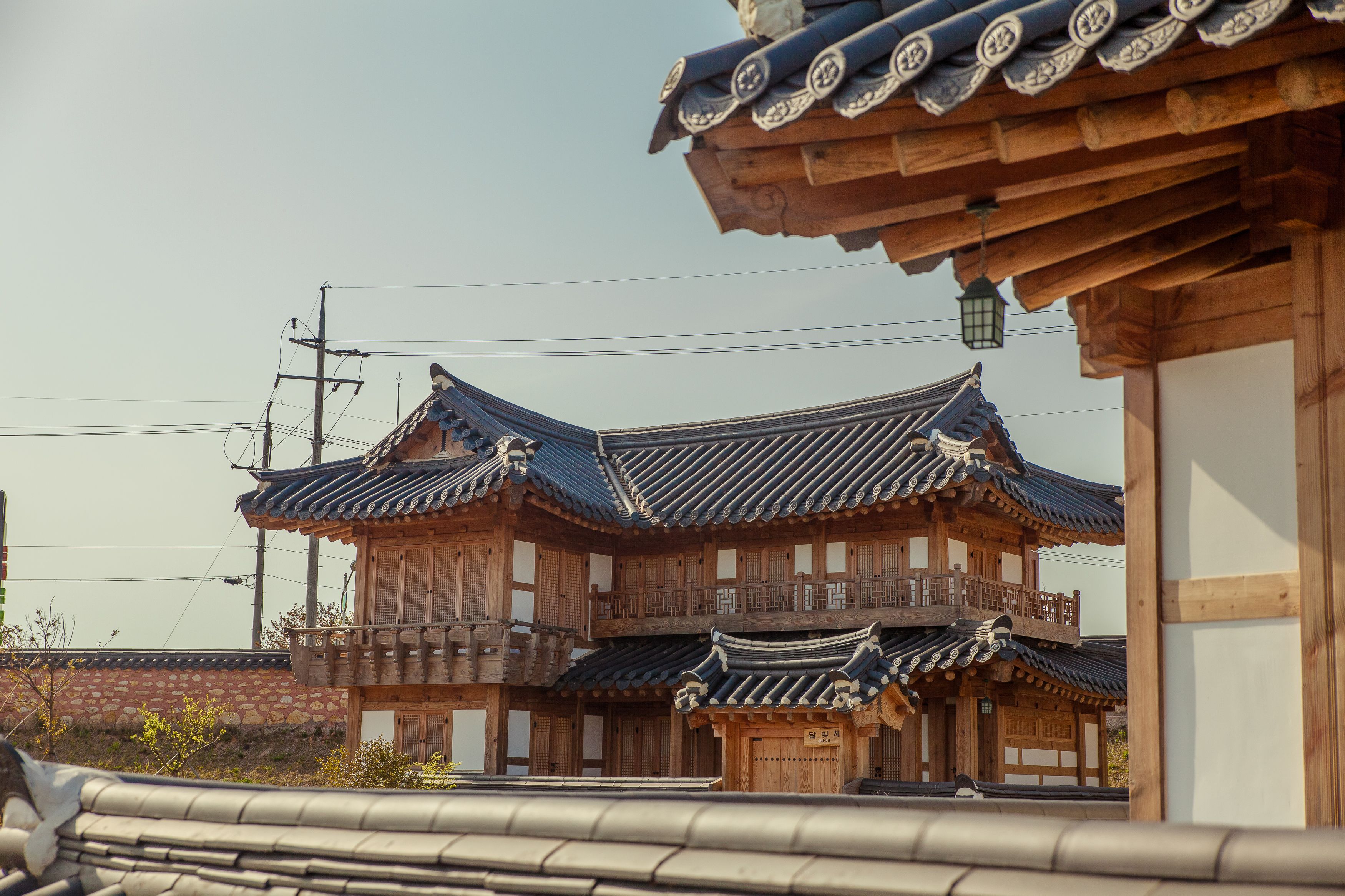 A traditional wooden building with multiple levels and a tiled roof.