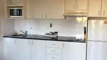 One Bedroom Villa | Private kitchen | Full-sized fridge, microwave, stovetop, coffee/tea maker