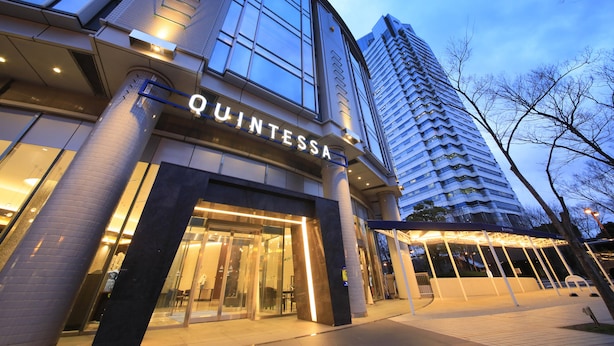 A modern building with a 'QUINTESSA' sign, large windows, and a covered entrance area. - Quintessa Hotel Osaka Bay (Osaka)