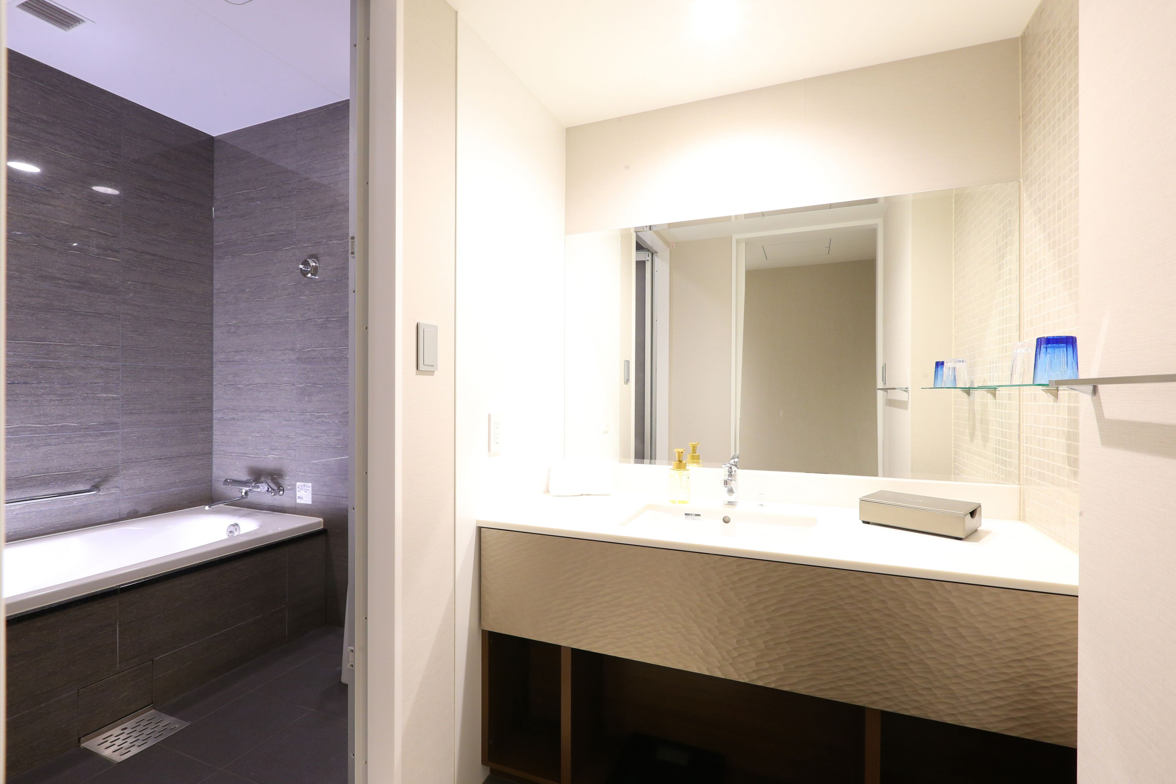 separate bathtub and shower, free toiletries, hair dryer, slippers