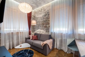 Deluxe Suite, Sea View | Living area | Flat-screen TV