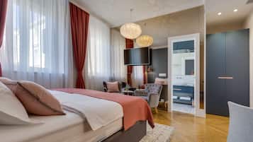 Premium bedding, free minibar items, desk, laptop workspace