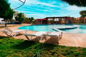 Outdoor pool, pool umbrellas, pool loungers