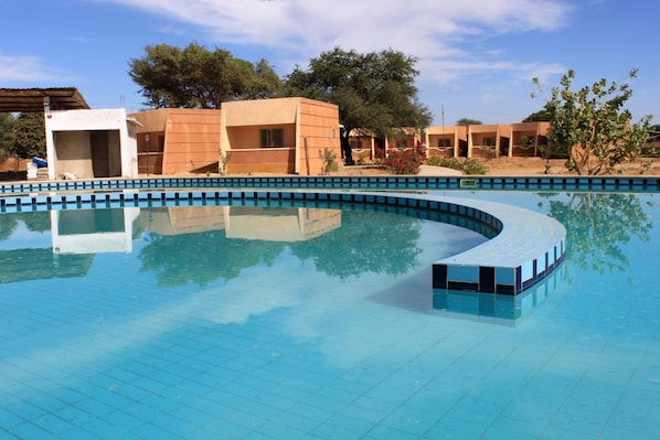 Outdoor pool, pool umbrellas, sun loungers