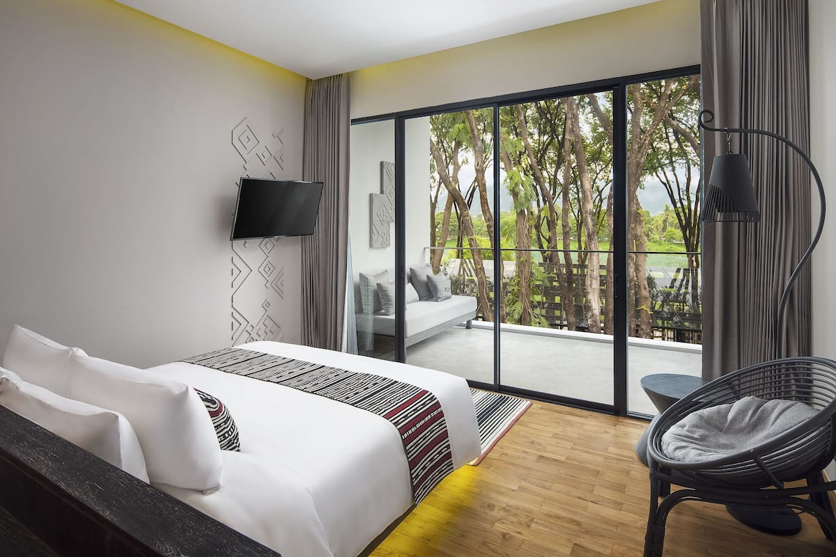 Suite, River View | Minibar, in-room safe, desk, laptop workspace