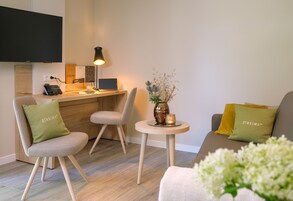 Superior Suite, 1 Bedroom | Living room | Flat-screen TV