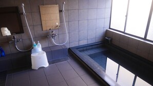 A modern bathroom with a glass-enclosed jacuzzi, a wall-mounted towel rack, and a hand dryer. - Sosuke (Takayama)