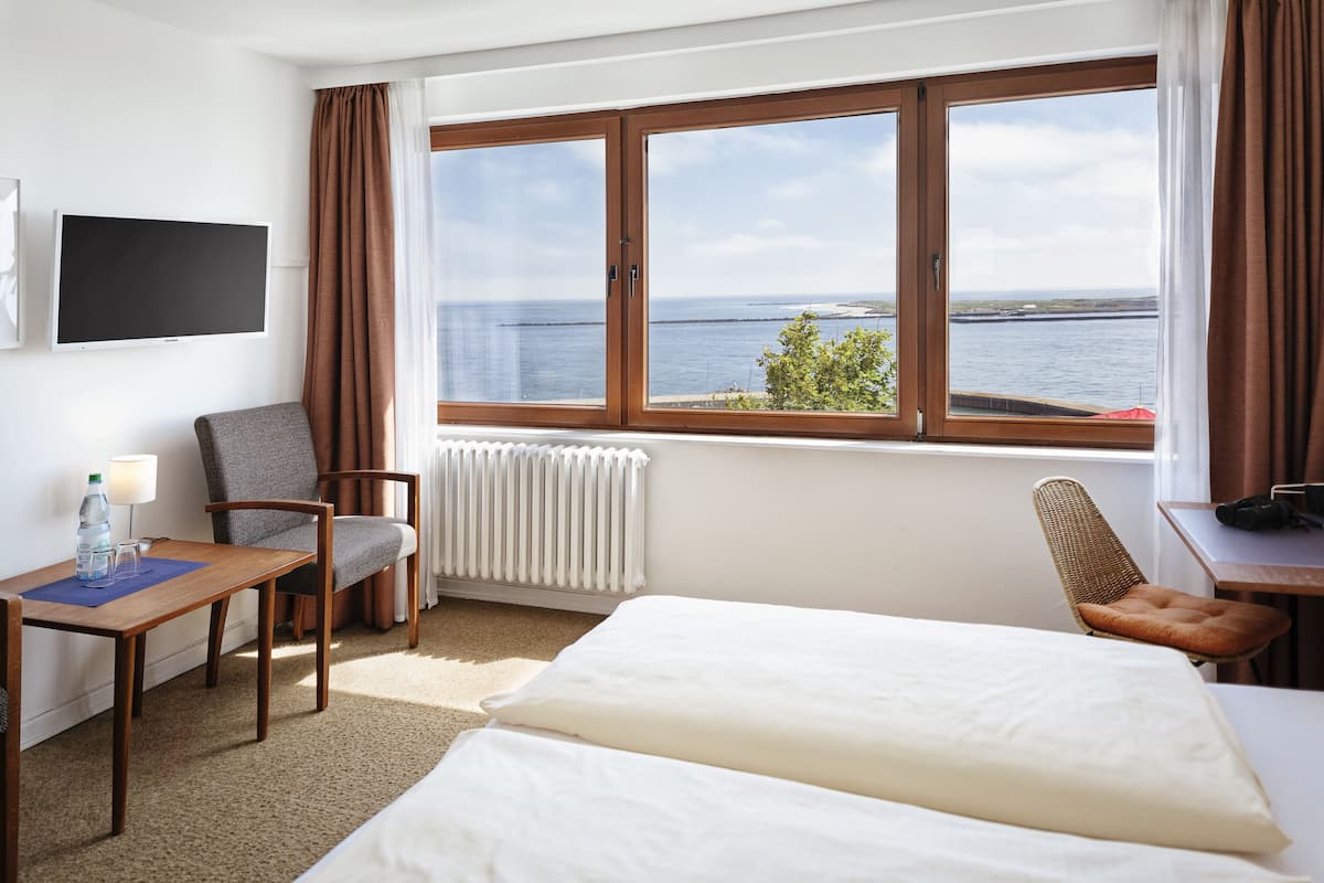 Double Room, Sea View | Living area | 45-inch flat-screen TV with satellite channels, TV