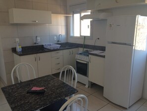 Fridge, stovetop, cookware/dishes/utensils
