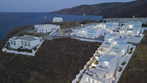 A coastal hotel with multiple white buildings, each labeled with names like 'Seabed Coral' and 'Pearl'. - Aegean Sea Villas (Astypalaia)