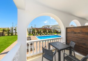 Seasonal outdoor pool, open 8:00 AM to 7:00 PM, pool umbrellas