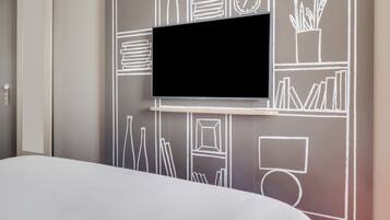 Rideaux occultants, chambres insonorisées, fer et planche à repasser