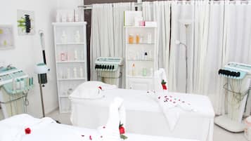 Experience a serene spa retreat with two treatment beds, a shelf for wellness products, and a spacious cabinet for treatments.
