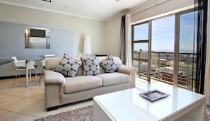 Luxury Apartment | Living room | 40-inch Smart TV with satellite channels, TV, Netflix