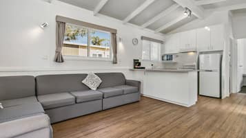 Villa, Lagoon View | Living area | Flat-screen TV, DVD player