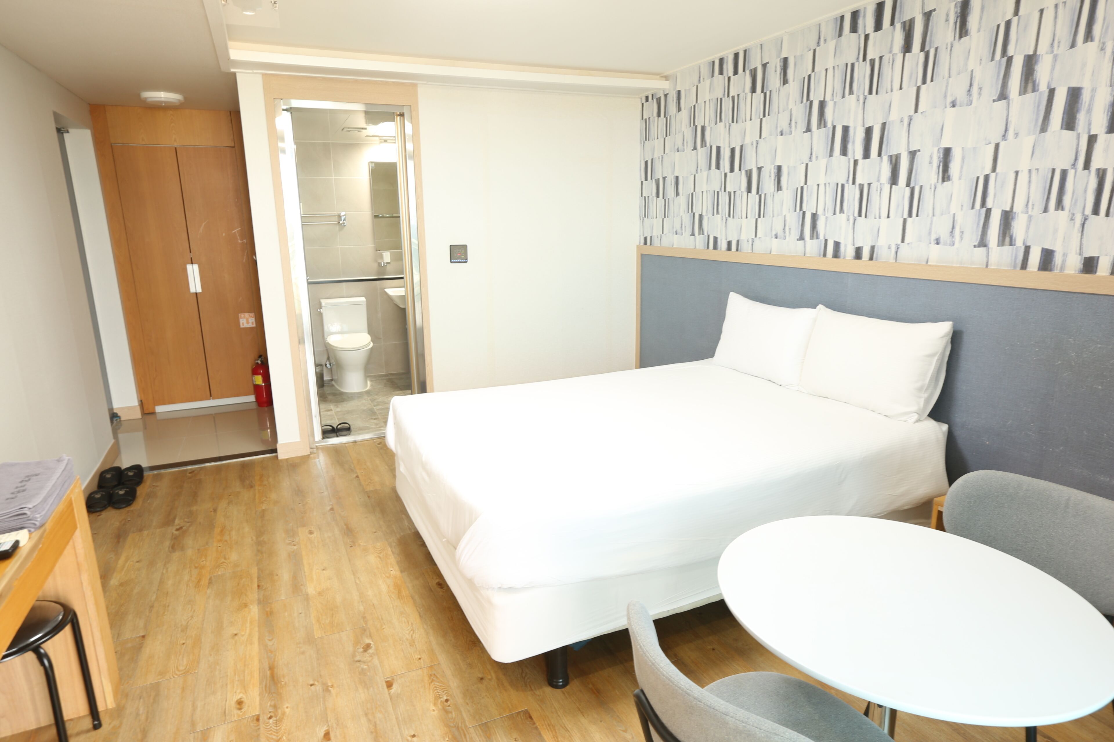 Premium bedding, laptop workspace, blackout drapes, soundproofing