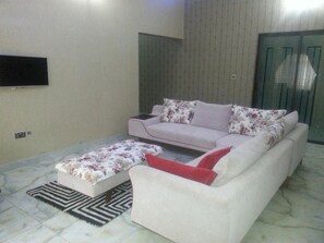 Apartment, 3 Bedrooms | Living area | Flat-screen TV - Tenache Hotels (Abuja)