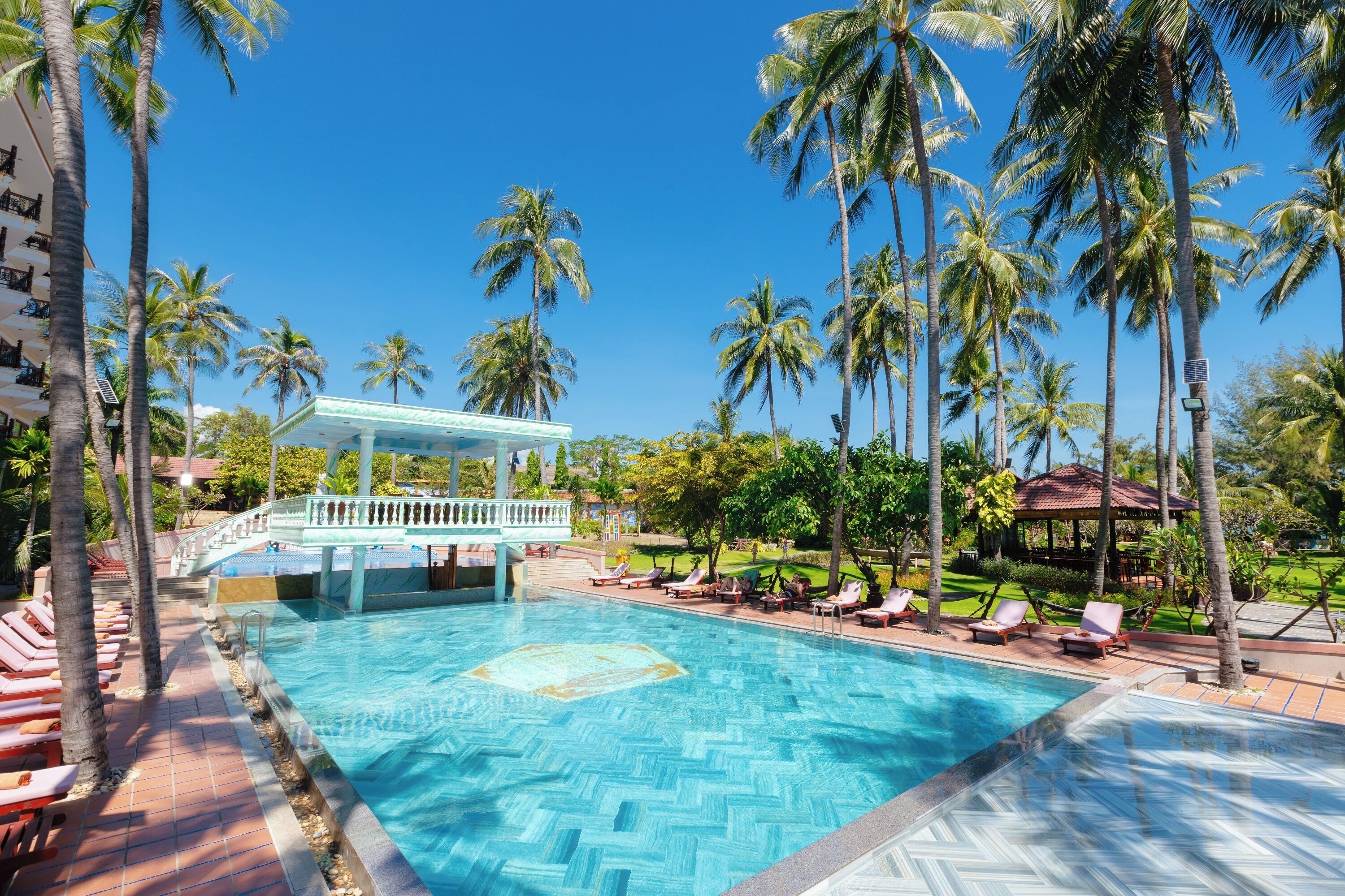 Outdoor pool, open 7:00 AM to 9:00 PM, pool umbrellas, pool loungers
