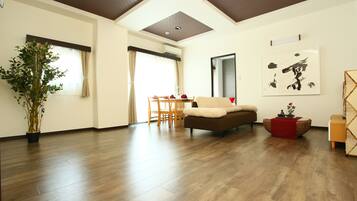 Deluxe Condo, Multiple Bedrooms | Living area | Flat-screen TV
