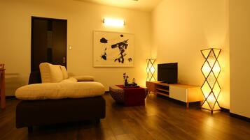 Deluxe Condo, Multiple Bedrooms | Living room | Flat-screen TV