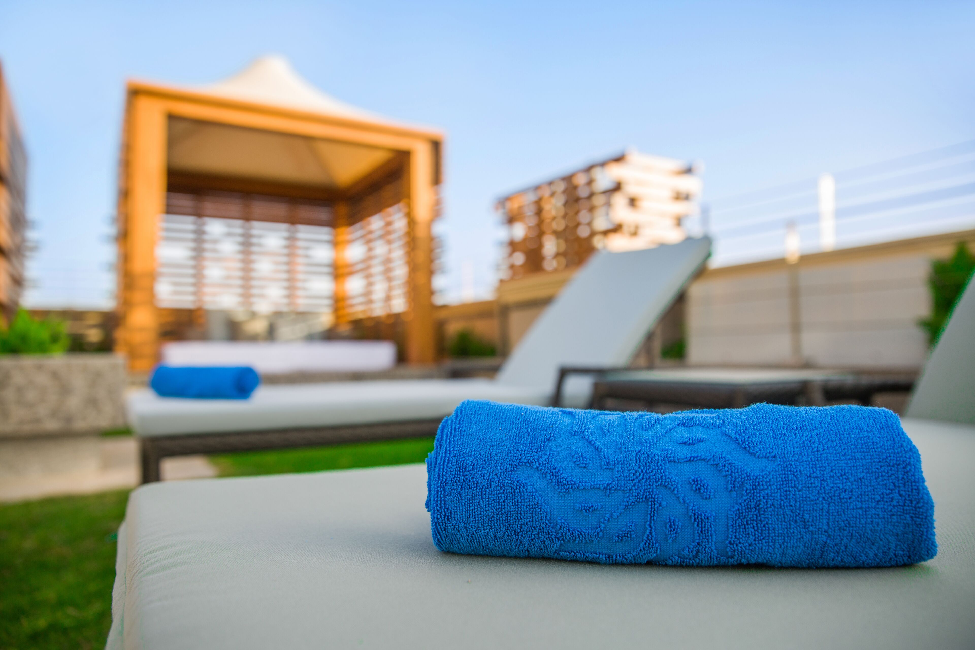 outdoor pool, open 7 am to 8 pm, pool umbrellas, pool loungers