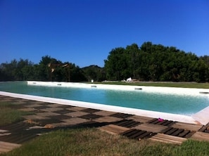 Seasonal outdoor pool, pool loungers