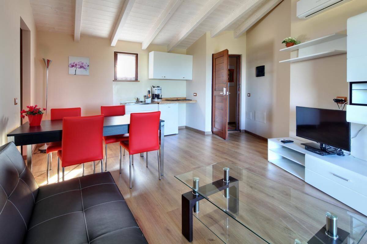 Suite, 1 Bedroom | Living room | LCD TV
