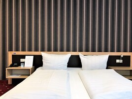 Premium bedding, desk, laptop workspace, free WiFi