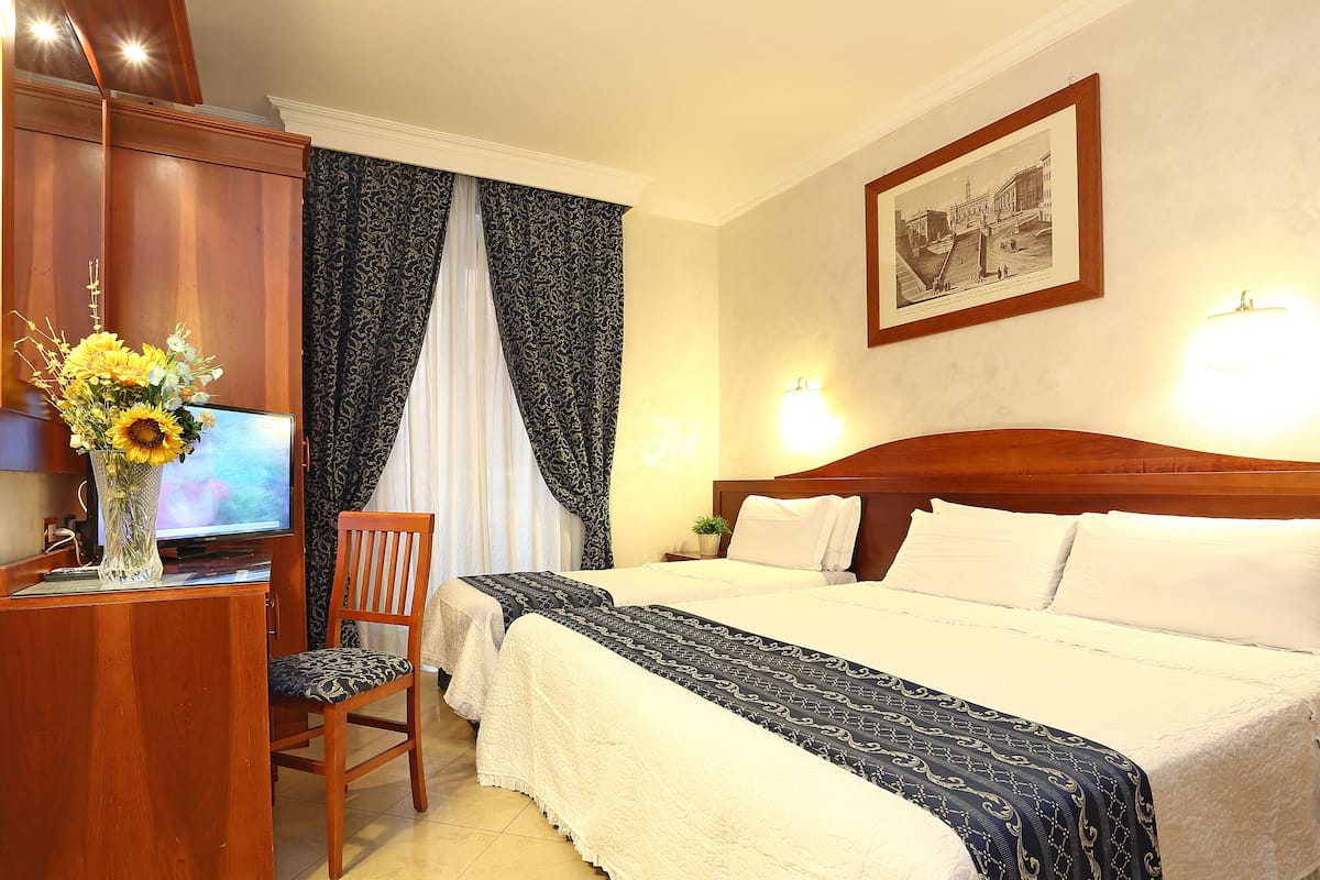 Triple Room | Minibar, in-room safe, desk, soundproofing