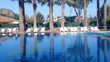 Seasonal outdoor pool, pool umbrellas, sun loungers