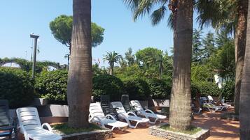 Seasonal outdoor pool, pool umbrellas, pool loungers
