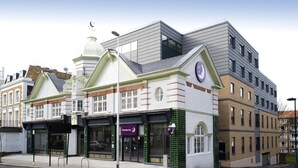 A hotel with a prominent marquee sign, a corner location, and a traditional architectural style. - Premier Inn London Clapham (London)
