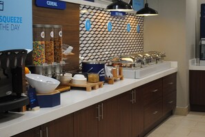 A breakfast bar with cereal, fruit, and coffee options. - Holiday Inn Express & Suites Columbia City by IHG (Columbia City)