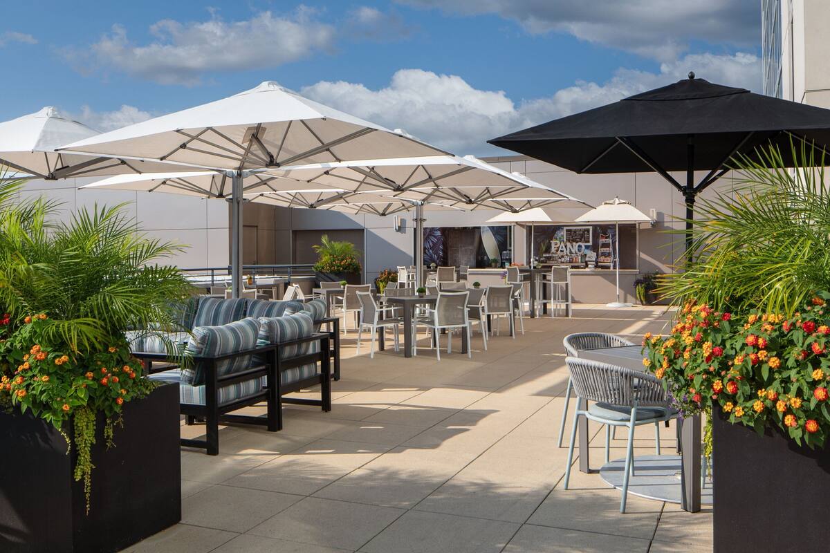 seasonal outdoor pool, open 10:00 am to 8:00 pm, pool umbrellas