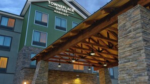 A hotel with a stone facade, a covered entrance, and a sign indicating it is a Marriott Townplace Suites. - TownePlace Suites by Marriott Denver South/Lone Tree (Lone Tree)