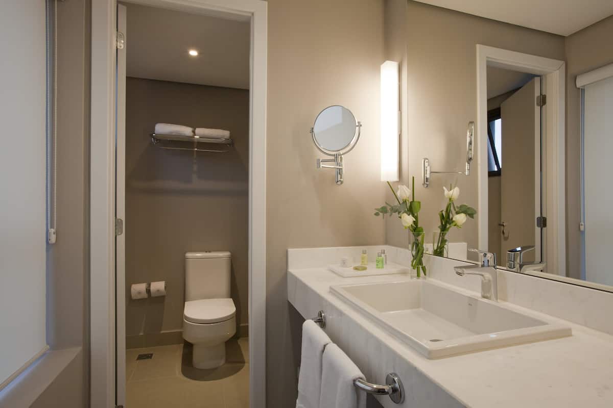 shower, rainfall showerhead, hair dryer, towels