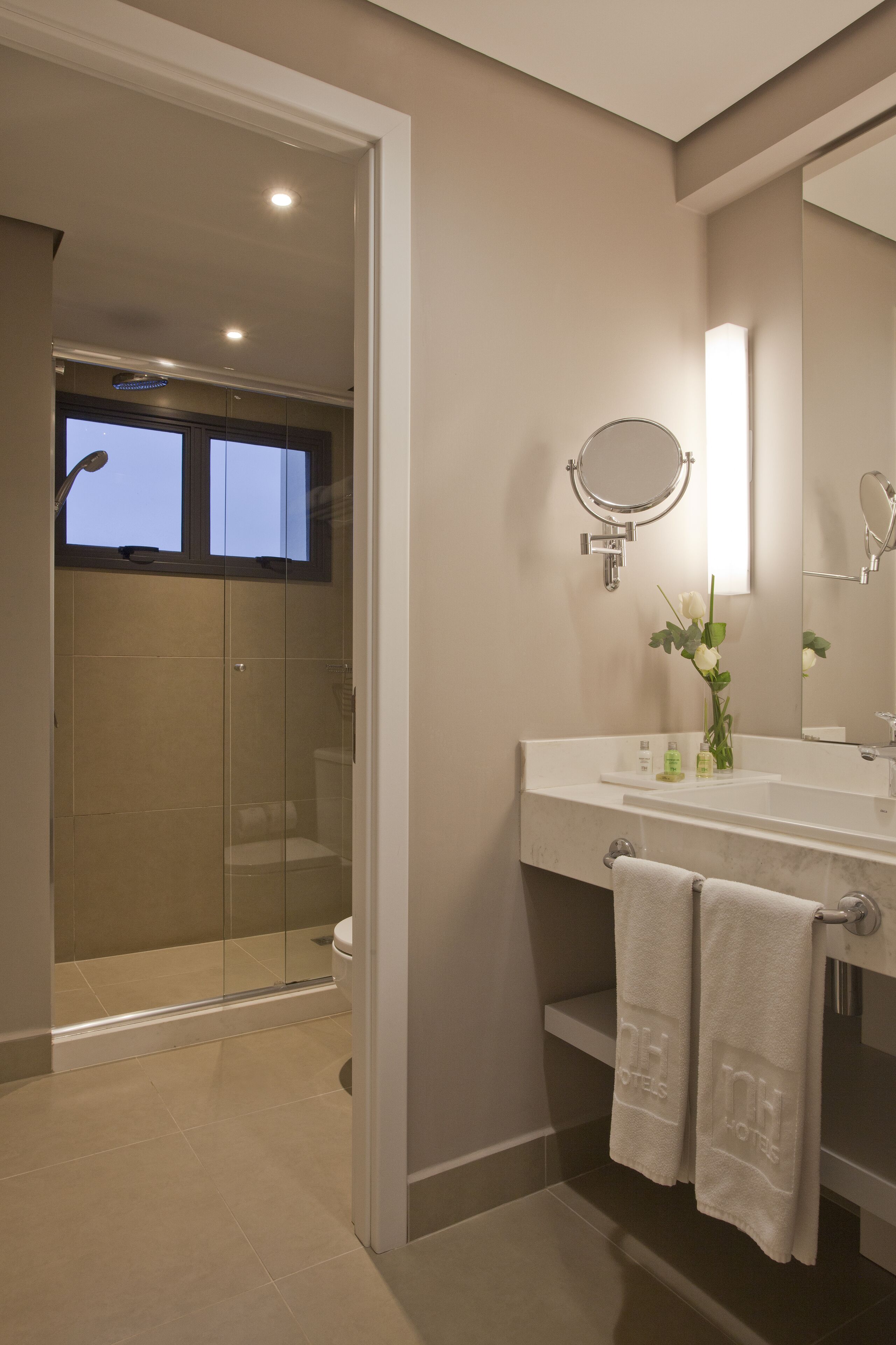 Shower, rainfall showerhead, hair dryer, towels