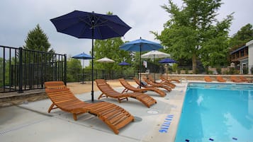 Seasonal outdoor pool, pool loungers