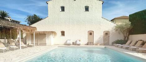 Outdoor pool, pool umbrellas, sun loungers