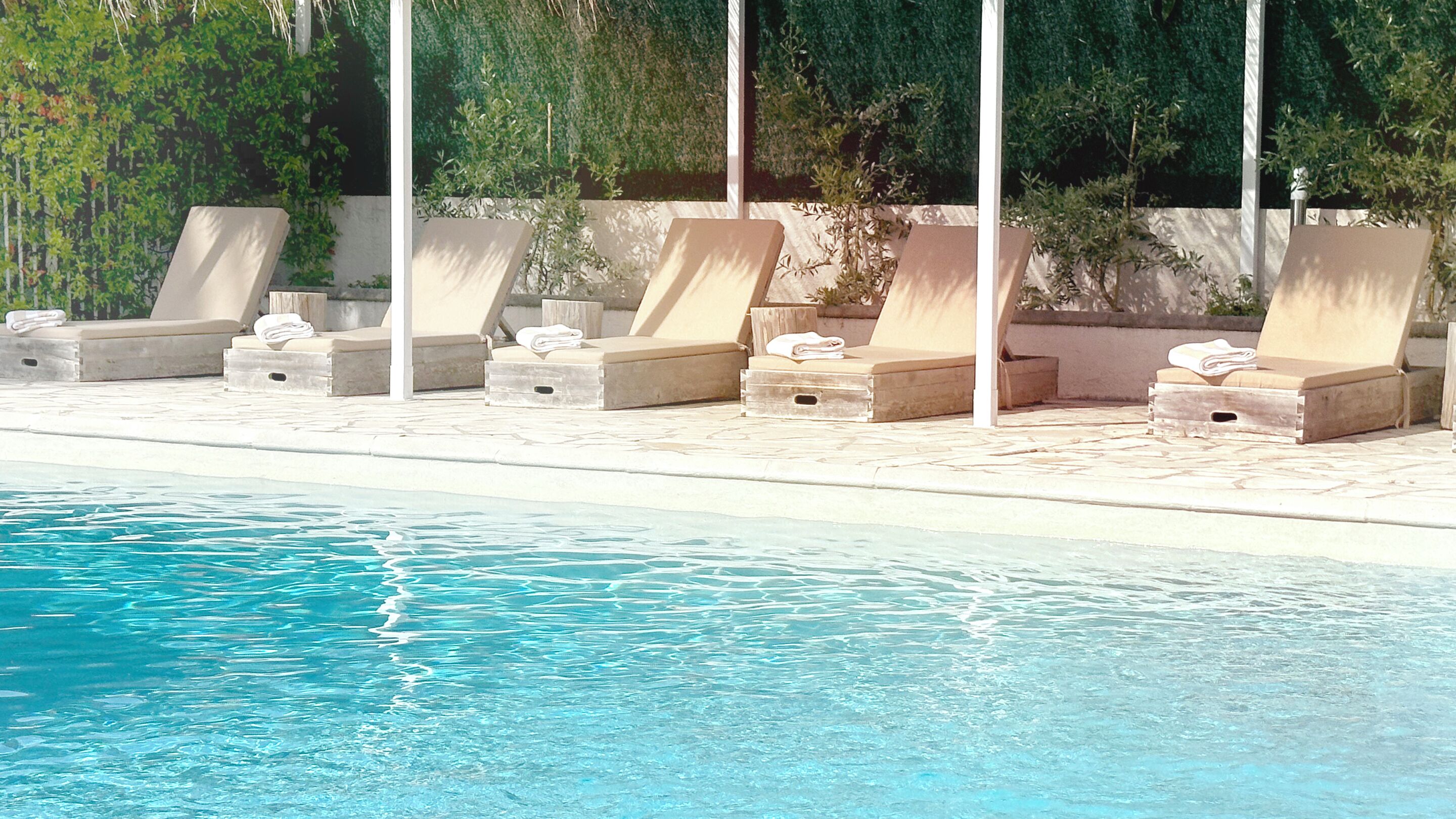 outdoor pool, pool umbrellas, pool loungers