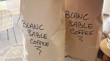 Two paper bags labeled "Blanc Sable Coffee" and "Blanc Sable Coffee?"