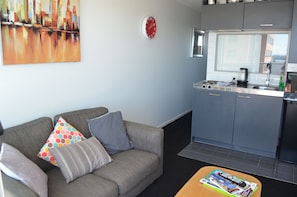 Two Bedroom Harbour Views Apartment | Living room | Flat-screen TV - Two Bedroom Harbour Views Apartment (Auckland)