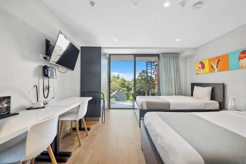Deluxe Twin Studio with balcony | Premium bedding, in-room safe, desk, soundproofing