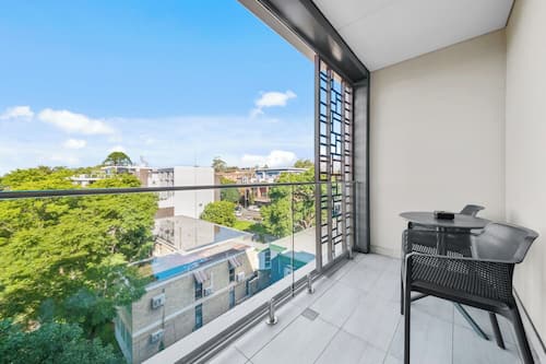 Deluxe Queen Studio with balcony | Premium bedding, in-room safe, desk, soundproofing
