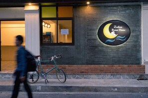 A building with a sign that reads 'Laluna River House' and a bicycle parked outside. - Laluna River House (Chanthaburi)
