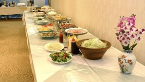 A buffet table with various dishes and condiments. - Osaka Bay Plaza Hotel (Sakai)