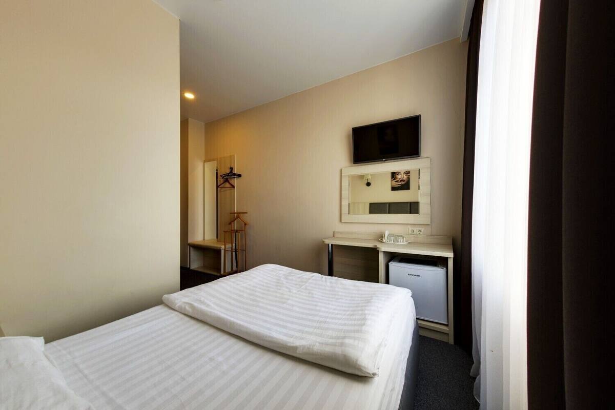 Standard Double Room | Minibar, desk, iron/ironing board, rollaway beds