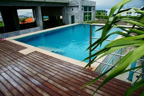 Outdoor pool, a rooftop pool, open 6:00 AM to 9:00 PM, pool loungers - Ananya Residence Service Apartment (Chonburi)