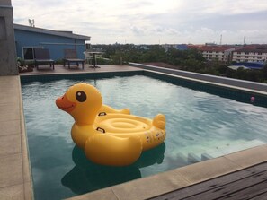 Outdoor pool, a rooftop pool, open 6:00 AM to 9:00 PM, pool loungers - Ananya Residence Service Apartment (Chonburi)